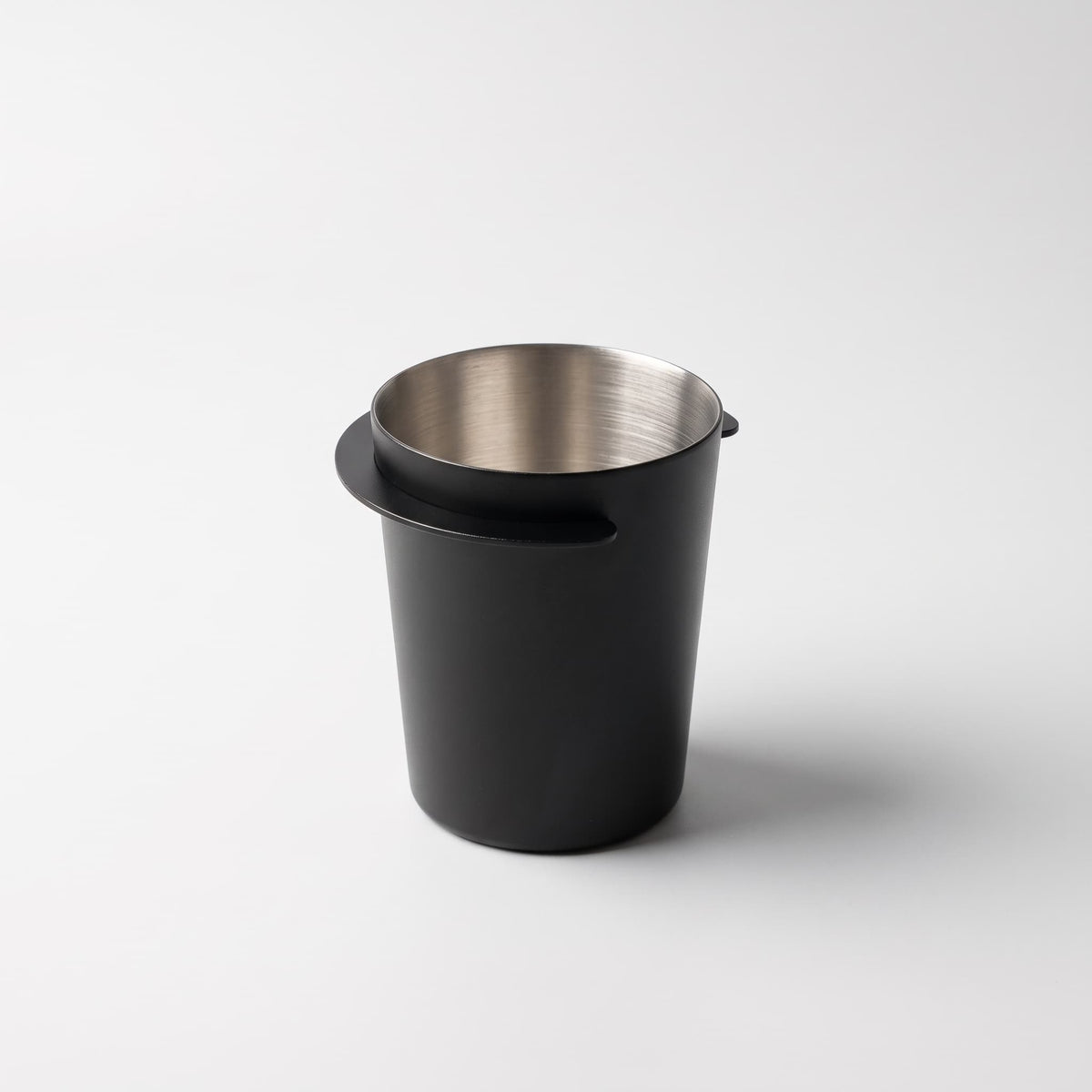 Doseringskopp for kaffe sort