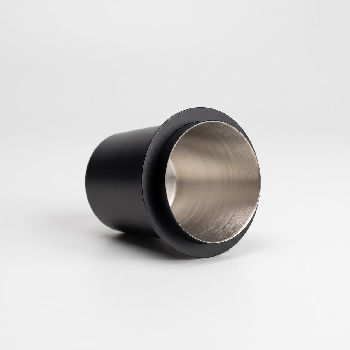 Doseringskopp for kaffe sort liggende